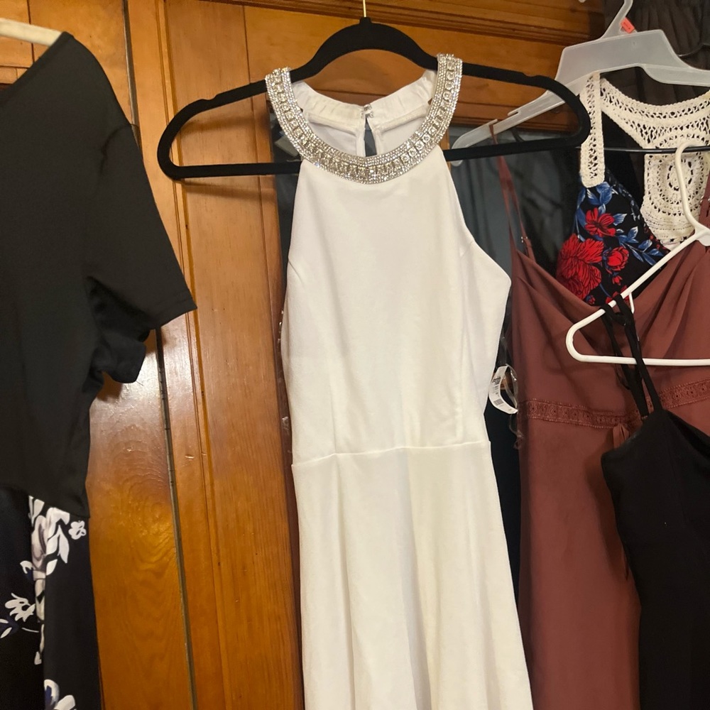 Put white sleeveless dress with beautiful faux diamond top. New with tags